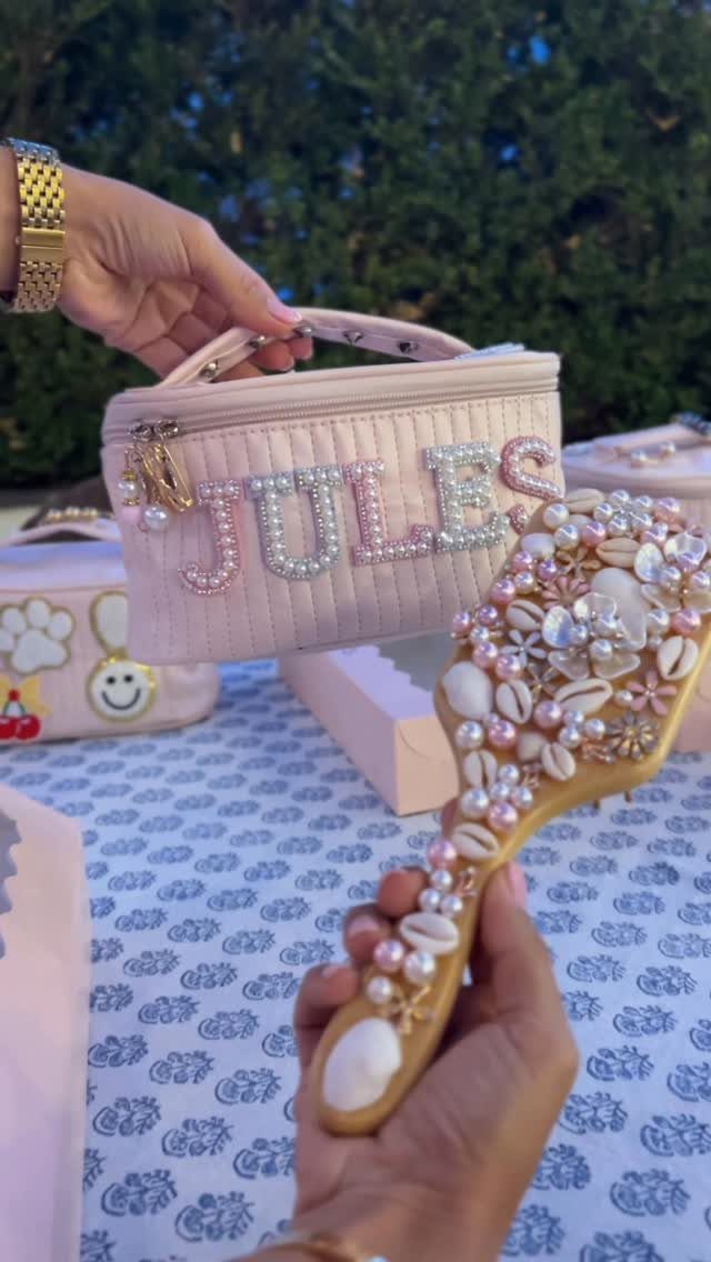 Pink quilted makeup bag and jeweled mirror as personalized birthday party favors.