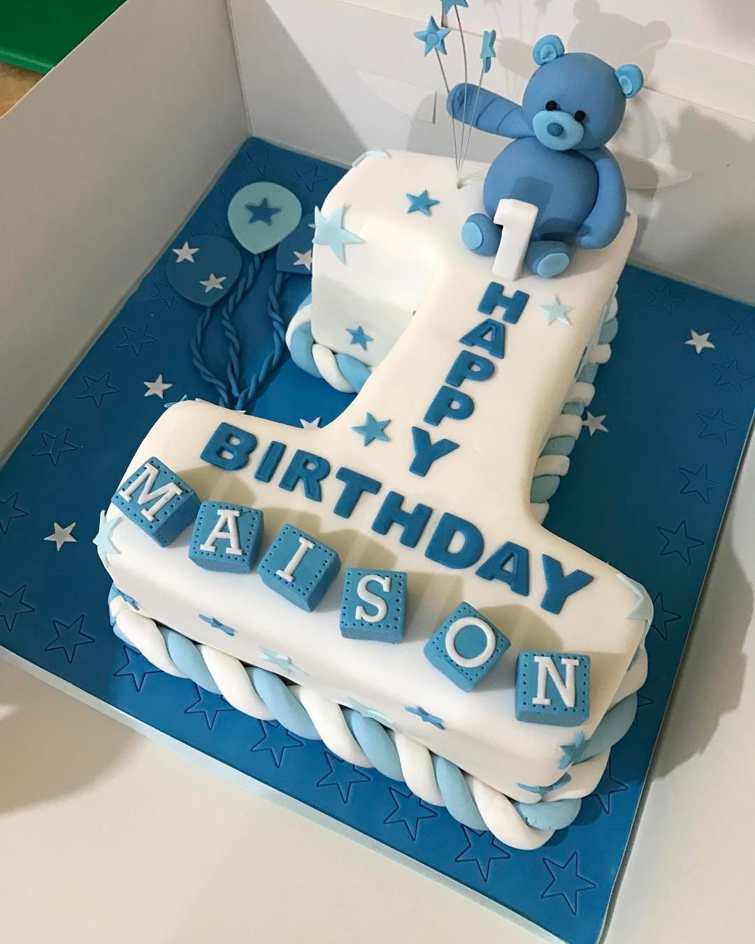 Number one shaped birthday cake with blue bear and lettering for Maison
