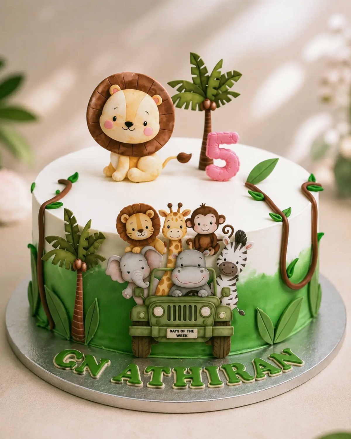 Jungle themed birthday cake with fondant animals and a pink number five topper