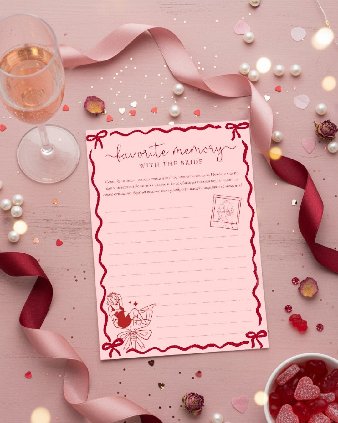 Pink memory card for a bride surrounded by rosé, ribbons, and heart candies.