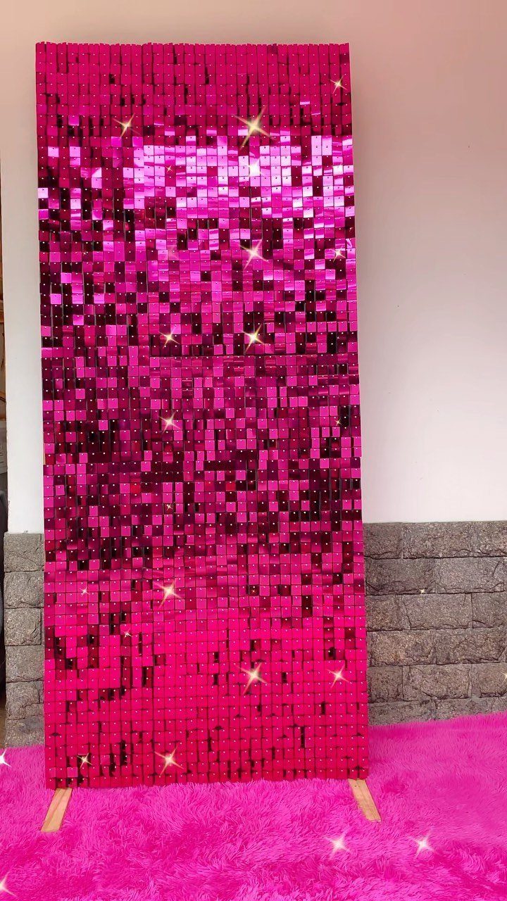 Hot pink sequin shimmer wall backdrop on a pink fuzzy carpet