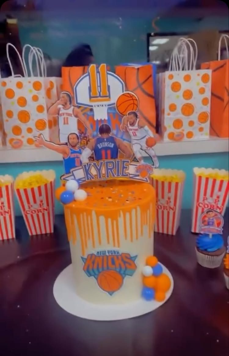Basketball themed birthday cake with orange drip and New York Knicks logo