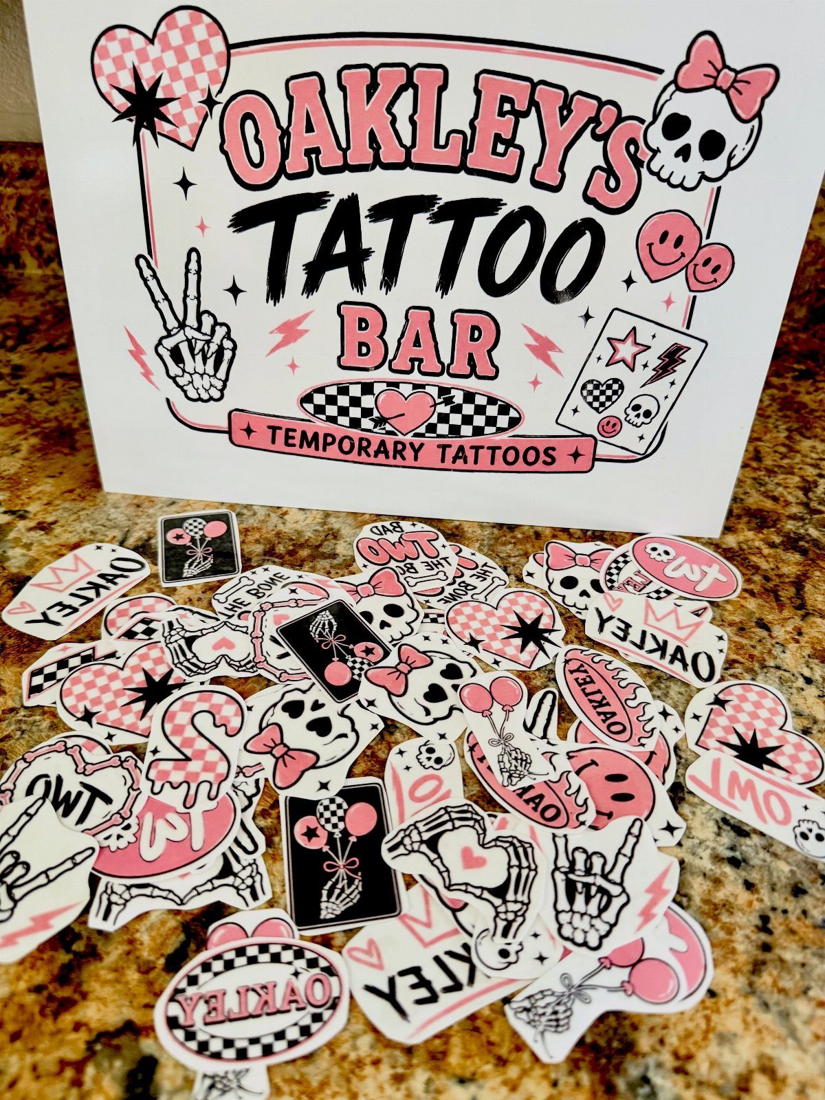 Temporary tattoos and a Tattoo Bar sign for a birthday party favor station.