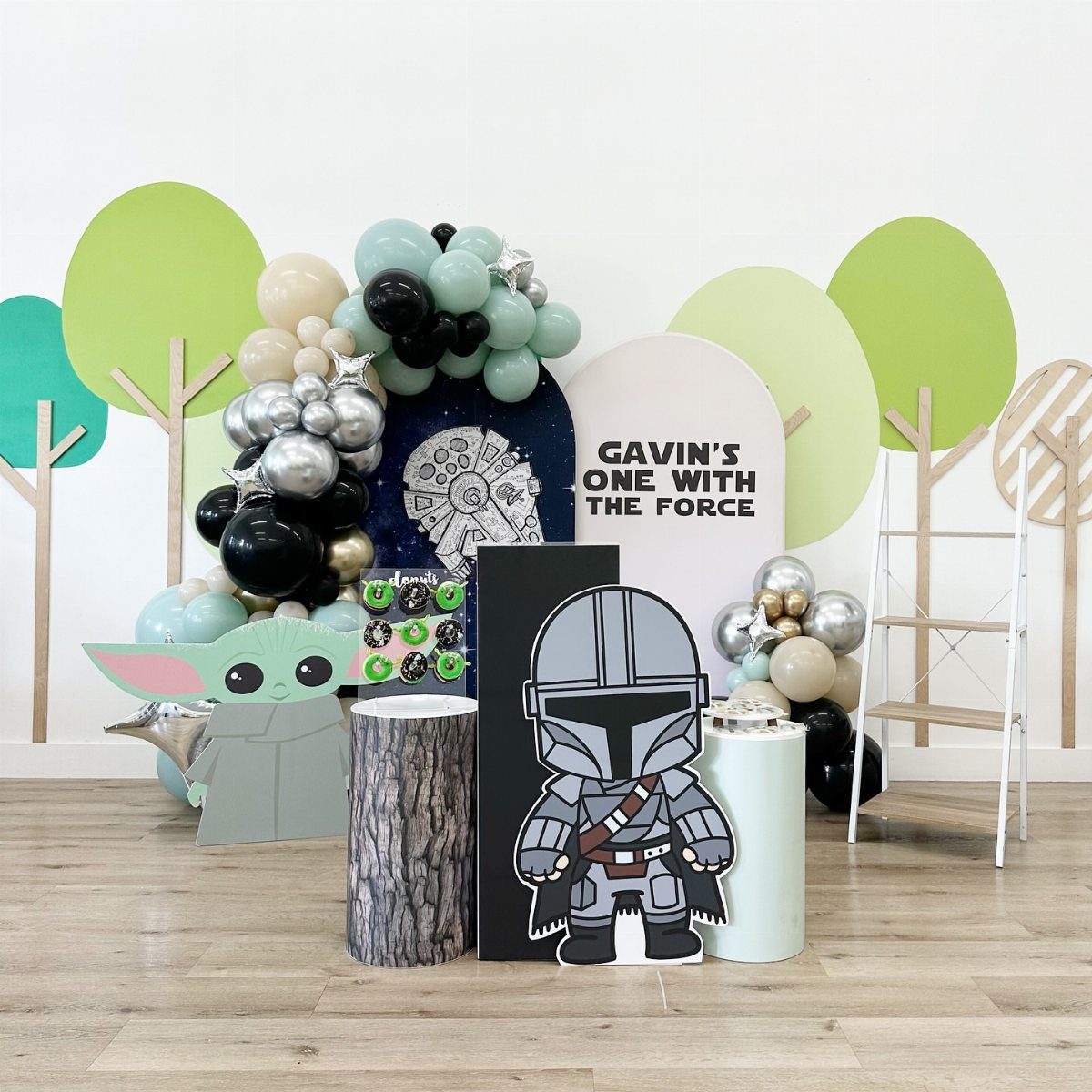 Star Wars party decorations with Grogu and Mandalorian cutouts, balloons, and themed signage.