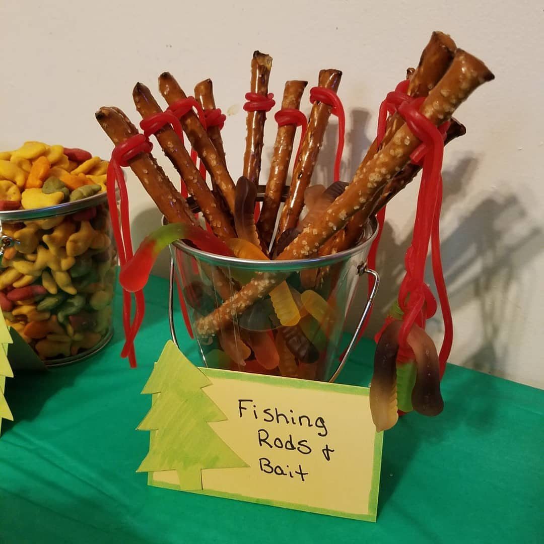 Pretzel sticks and gummy worms in a bucket labeled Fishing Rods and Bait