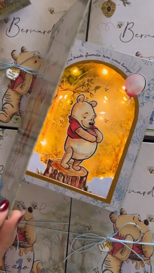Winnie the Pooh pop-up birthday invitation with golden lighting and 3D elements.