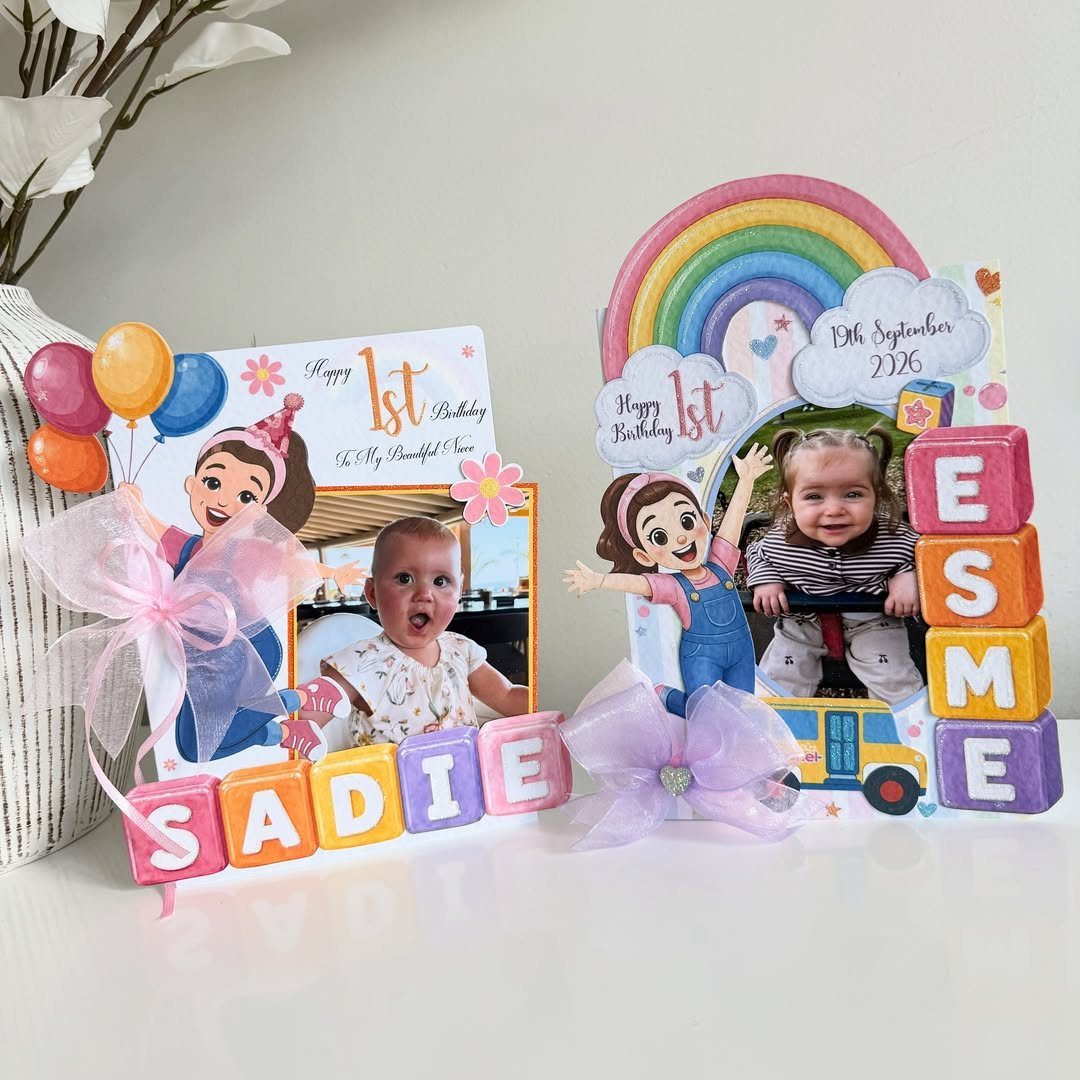 Personalized first birthday cards with baby photos, rainbows, and colorful 3D name blocks.