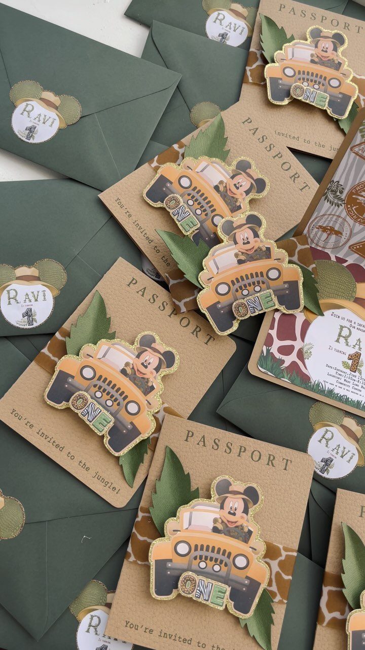 Safari themed first birthday invitations designed as passports with a cartoon mouse jeep.