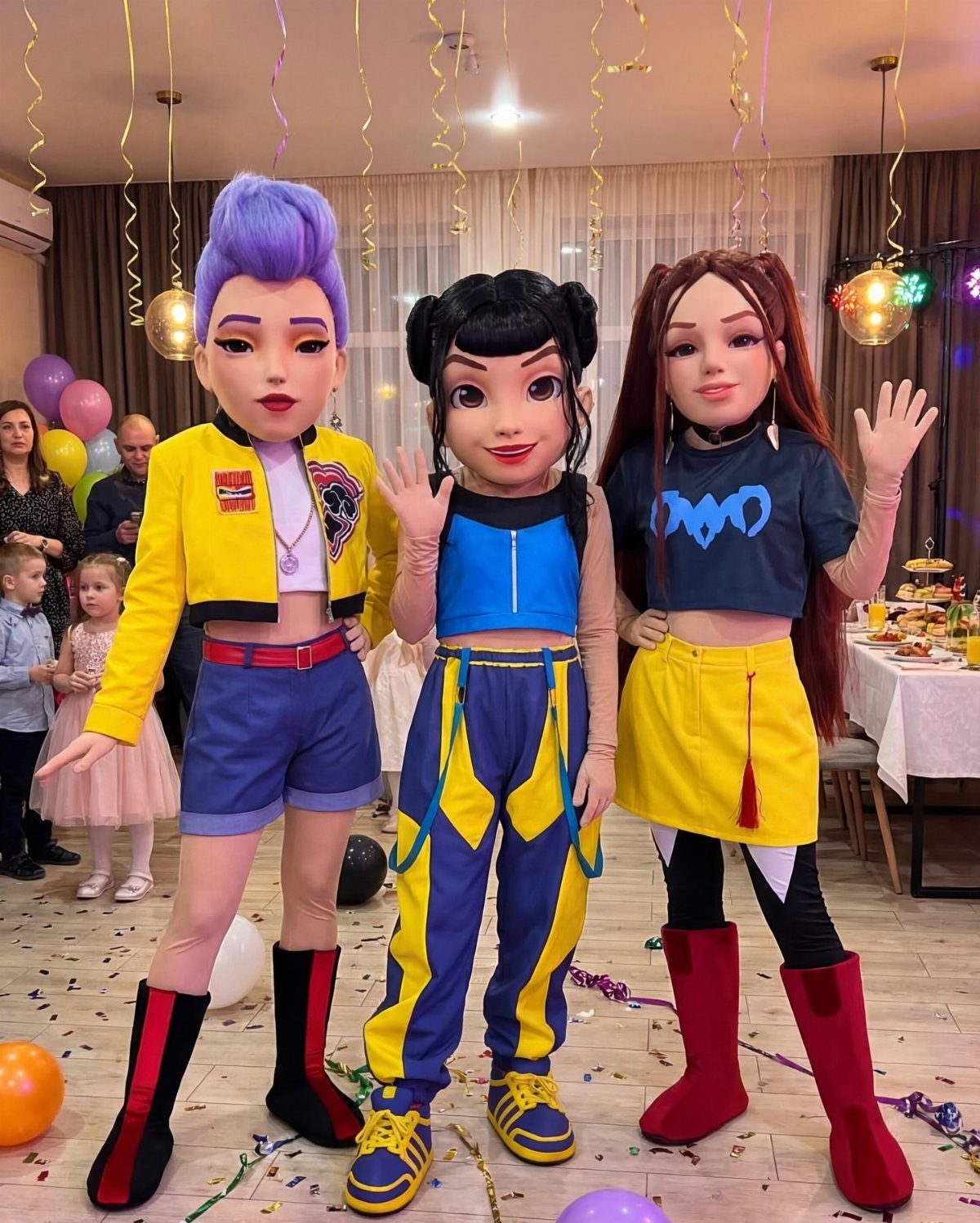 Three costumed characters with stylized masks posing at a children's birthday party.