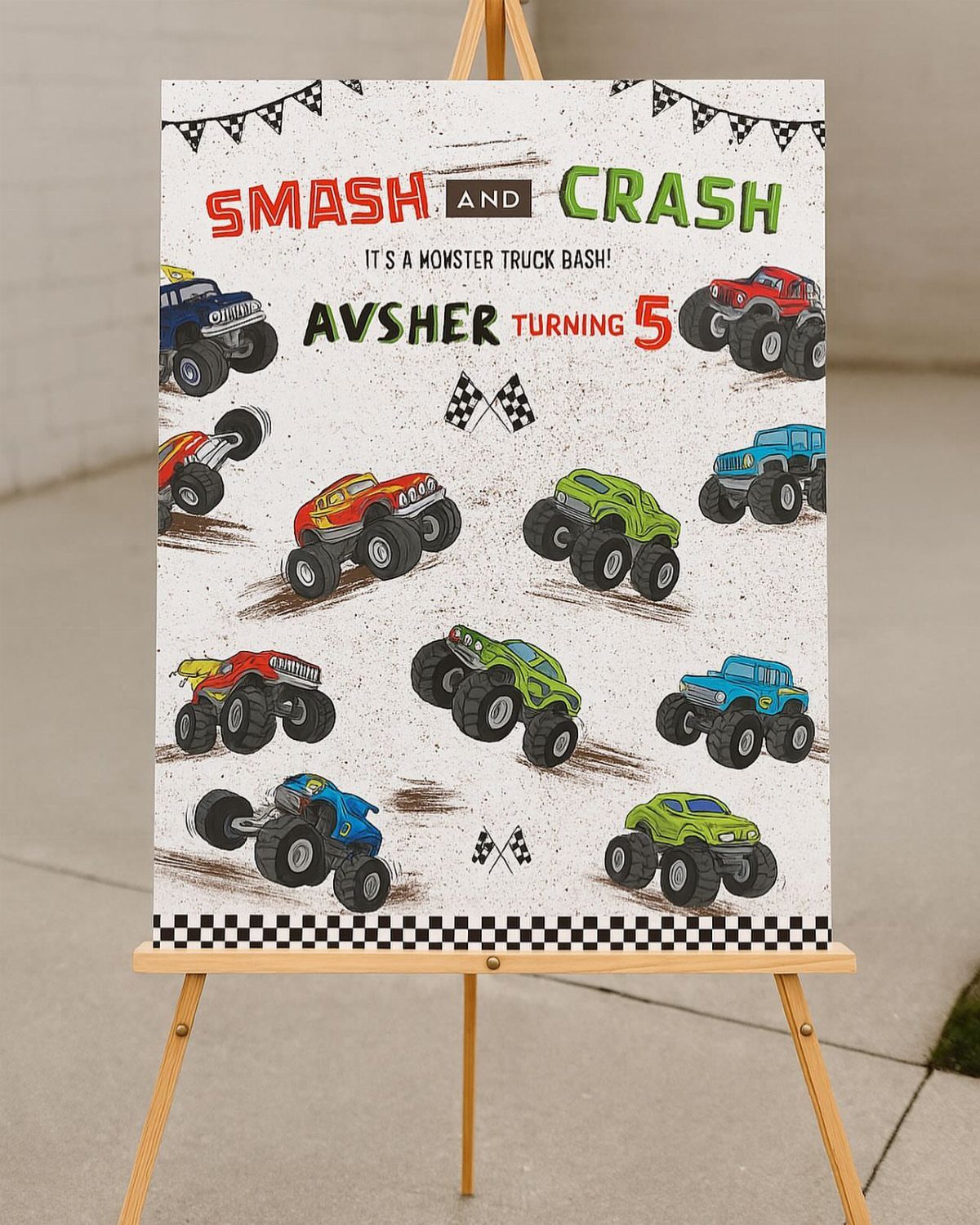 Monster truck welcome sign on a wooden easel for a fifth birthday party.