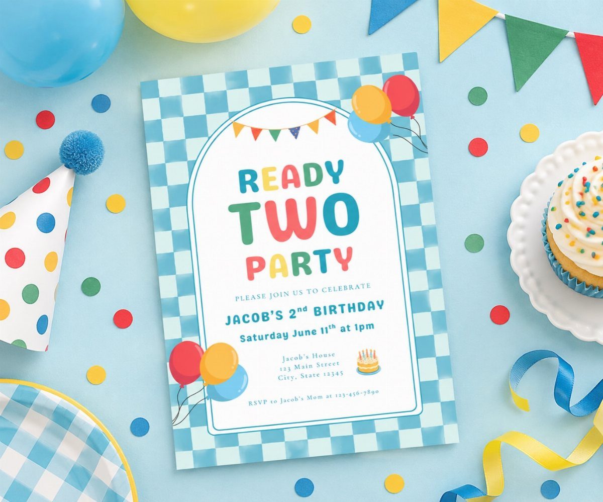 Birthday invitation card for a second birthday surrounded by colorful party decorations and cupcake.