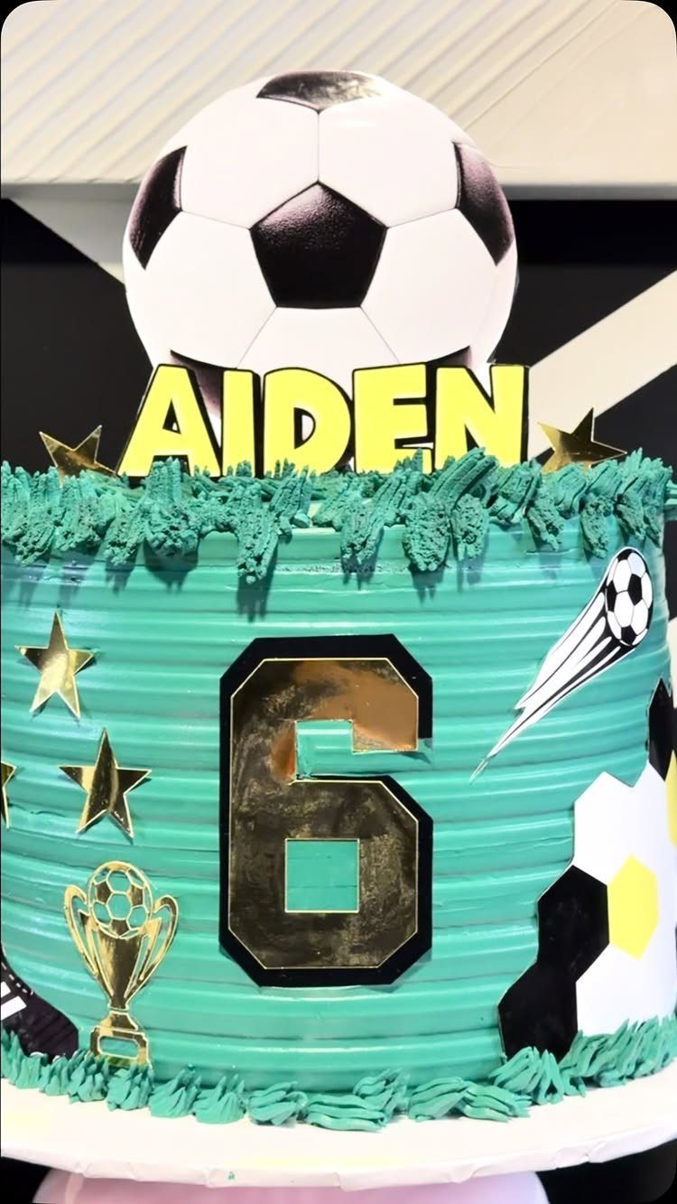 Teal soccer birthday cake with a gold number 6 and 3D soccer ball.