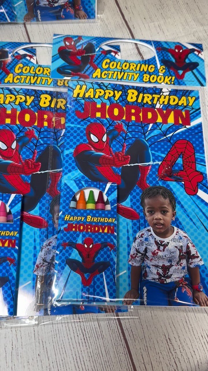 Personalized Spiderman coloring and activity books for a fourth birthday party favor.