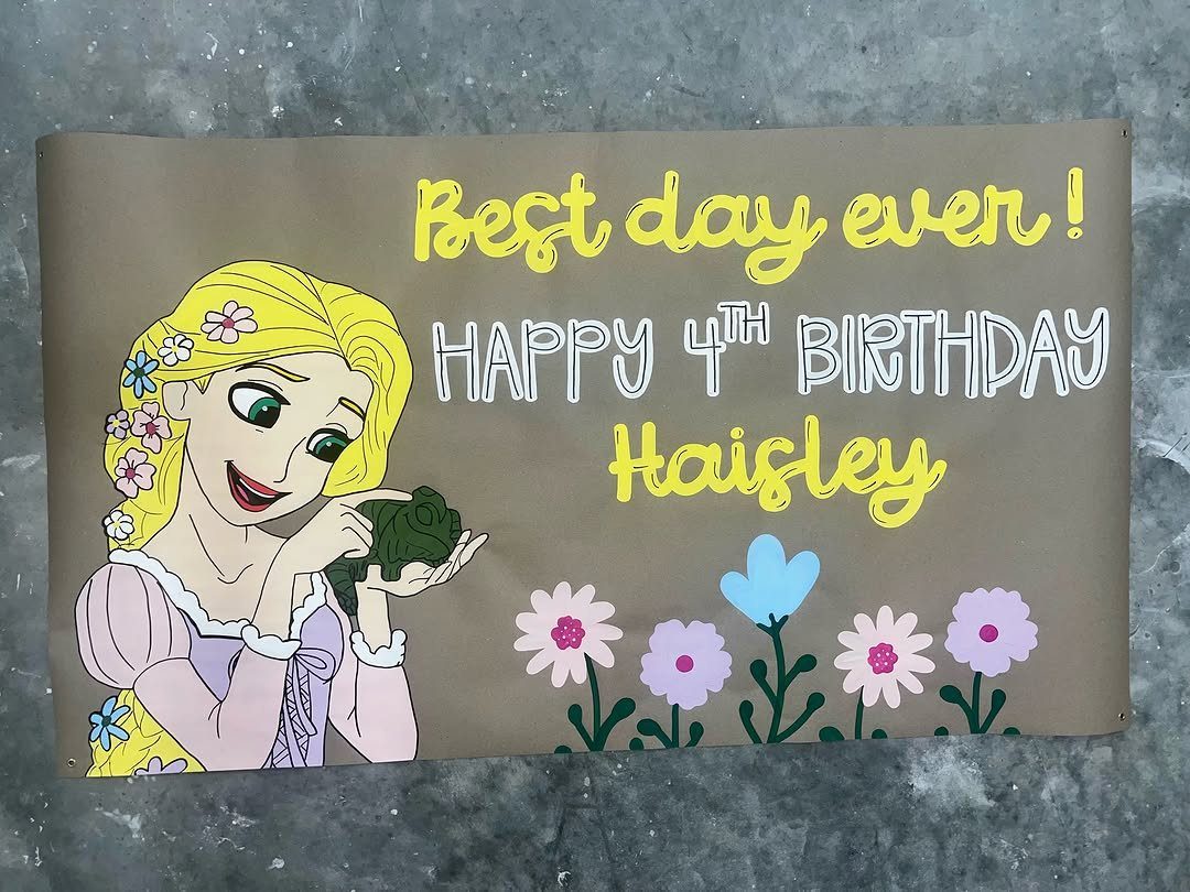 Brown birthday banner with Rapunzel illustration, colorful flowers, and personalized birthday text.