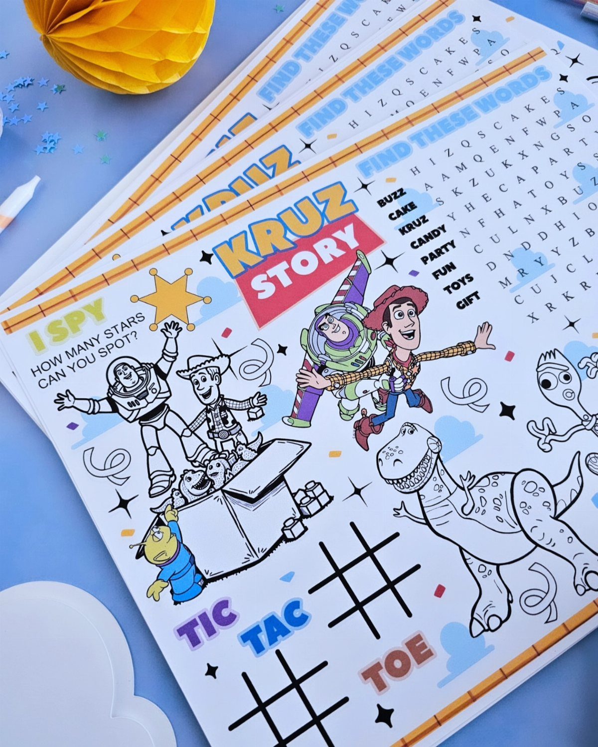 Toy Story activity sheet with word search and games on a blue background.